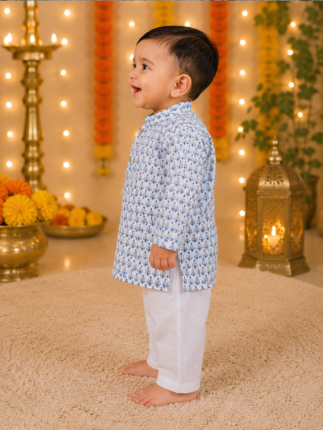 Side view of baby wearing blue floral full sleeve kurta with white pajama