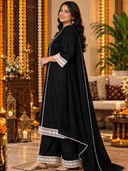 Side view of woman wearing black rayon kurta with lace sleeve detail and textured dupatta