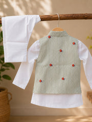 A children's traditional outfit hanging on a wooden hanger, featuring a white long-sleeve kurta and a sleeveless embroidered vest in light green and white vertical stripes with small red and blue floral motifs.